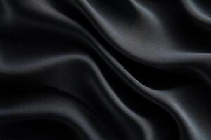 Dark, flowing fabric with subtle sheen and elegant drapes photo