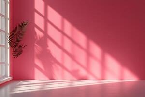Sunlight streams through window onto a pink wall, casting shadows of a palm frond photo