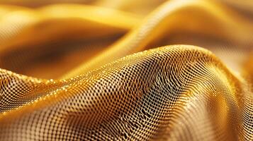 Golden, flowing mesh fabric with a subtle, textured pattern photo