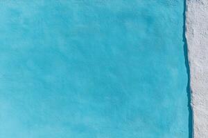 A blue wall with white paint and a white door photo