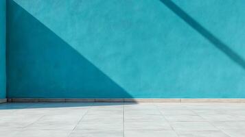 An empty room with a blue wall and a tiled floor photo