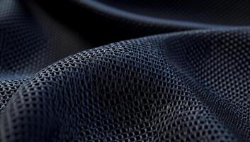 Dark gray mesh fabric with subtle waves and textured surface photo
