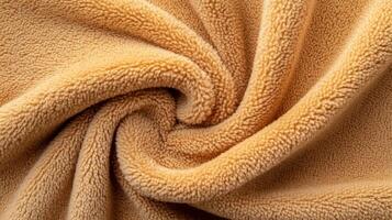 Soft, tan, plush fabric swirled elegantly photo