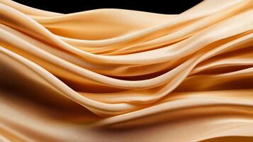 Elegant, flowing, golden fabric with soft, luxurious waves photo
