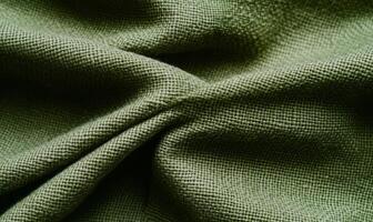 Olive green fabric texture, softly draped, showing subtle weave photo