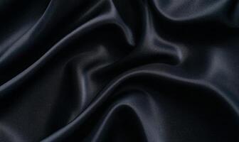 Dark, luxurious fabric with flowing, elegant drapes and soft sheen photo