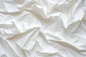 Draped white fabric with soft, flowing folds and creases photo