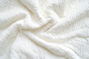 Soft, textured white fabric in a swirling pattern photo