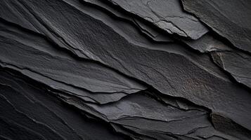 Dark grey slate stone texture, layered and rough photo