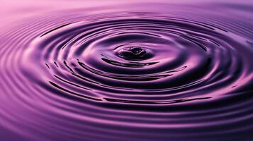 Purple liquid with concentric ripples from a drop photo