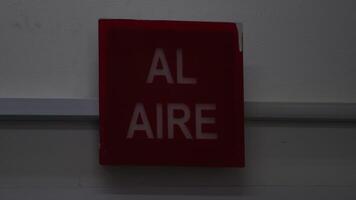 On Air sign lighting up, live broadcast indicator turning on, recording studio signal activation video