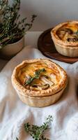 Mini chicken and mushroom quiches floating gracefully above a linen cloth with an ethereal glow photo