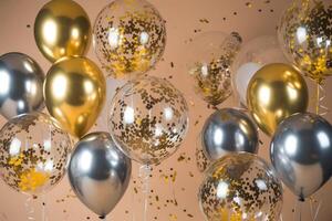 Gold and silver balloons with confetti float against beige background, creating a festive atmosphere photo