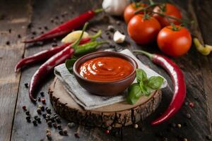 Red chili sauce, fresh peppers, and garlic create a spicy, homely atmosphere photo