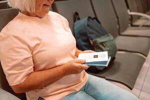 Qr code, check in and man with a phone for a ticket, airplane booking and information at airport. Travel, website and hand of a businessman reading a barcode on a mobile for a work trip or vacation photo