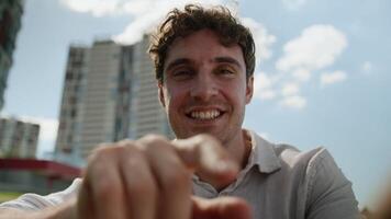 Pov happy Caucasian man using mobile phone smartphone typing message smiling laugh joyful male webcam addicted touch screen view display touchscreen cellphone gadget guy city chatting outdoor street video