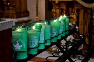 Holy week celebration in Spain with illuminated candles in church setting photo