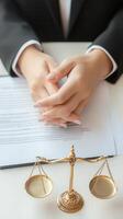 Lawyer joining hands over contract with scales of justice photo
