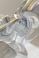 A close up of a glass object with a rainbow reflection photo