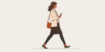 A woman walking with her phone in her hand photo