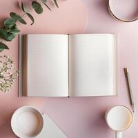 Open notebook, cup of coffee and pen on pink background photo