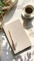 Coffee and notebook on marble table photo