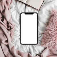 Blank iphone mockup on bed photo