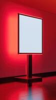 A large white screen is sitting on a red floor photo