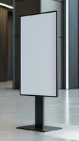 A blank white sign on a stand in a room photo