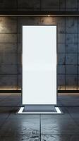 An empty white billboard stands in front of a wall photo