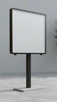 A white board on a stand in front of a plant photo