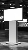 A white billboard stands in a large room photo