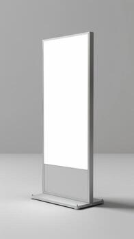 A white blank sign on a stand in front of a gray wall photo