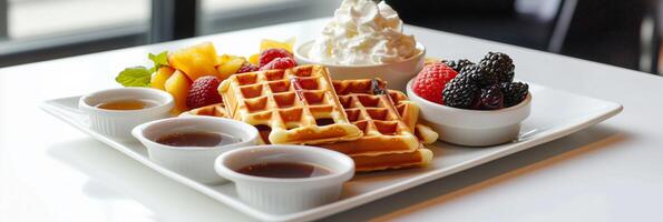 Belgian waffle with syrup, whipped cream, and a mix of raspberry and blackberry, banner photo