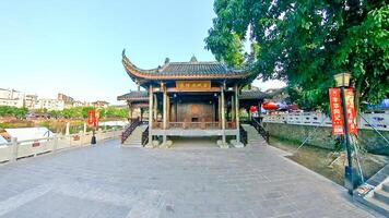 a chinese temple with a large building in the middle photo