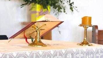 a gold altar with a candle and book on it photo