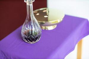 Holy Item of worship chalice cup with bread and wine for communion in a church photo