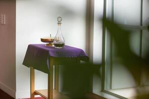 Holy Item of worship chalice cup with bread and wine for communion photo