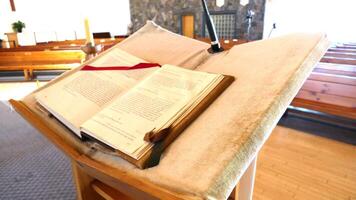 a book is on a stand in a church photo