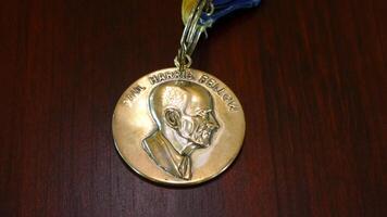 a medal with a portrait of a man on it photo