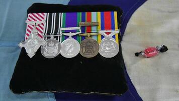 a bag with several medals and candy on it photo