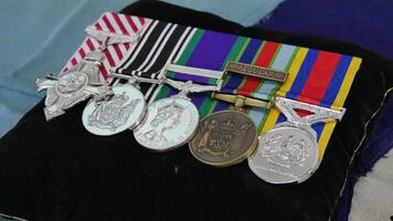 a group of medals on a pillow photo