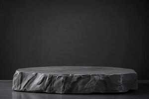 Dark textured stone platform on black background for product display photo