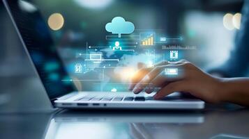 A person using a laptop with cloud computing icons on the screen photo