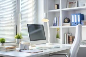 A white desk with a computer and a chair photo