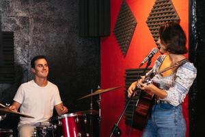 Music group rehearsing in a music venue. Practise in progress photo