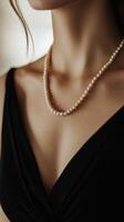 Black Dress Elegance with Pearl Touch photo