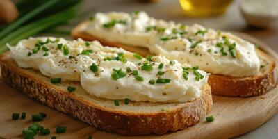 Creamy spread on toasted bread garnished with fresh chives in a cozy kitchen setting during afternoon light photo
