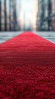 Elegant red carpet leading to an event venue in an urban setting during twilight hours photo