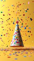 Colorful confetti and party hat create a festive atmosphere for celebrations and events photo